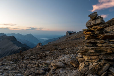 Scenic view of rocky mountains against sky during sunset