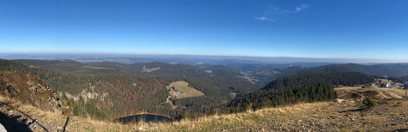 Scenic view of landscape against blue sky