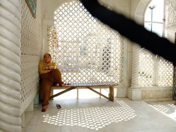 Woman in corridor of temple