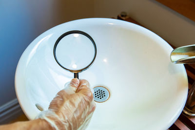 High angle view of person hand on table