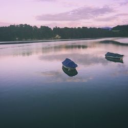 View of boats in lake against the sky