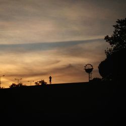 Low angle view of silhouette trees against sky during sunset