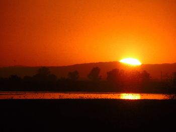 Scenic view of lake during sunset