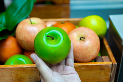 Person holding apples