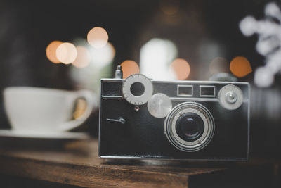 Close-up of camera on table