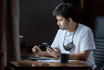 Young man using mobile phone