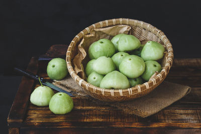 Close-up of fruits in basket on table