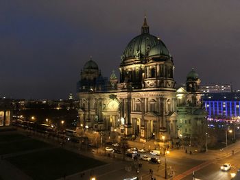 Illuminated buildings in city at night