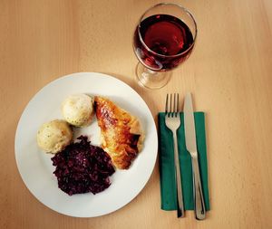 High angle view of lunch with wine served on table