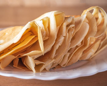 Food photophone of homemade pancakes on a white plate close up blurred focus