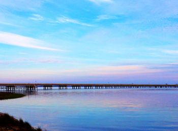 Scenic view of sea against cloudy sky