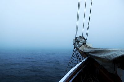 Boat sailing on sea against sky