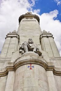 Low angle view of statue against sky