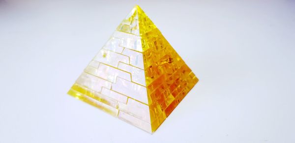 Close-up of yellow flag against white background