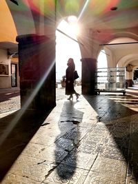 Man and woman walking in corridor