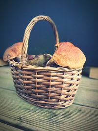 Close-up of fruit in basket on table