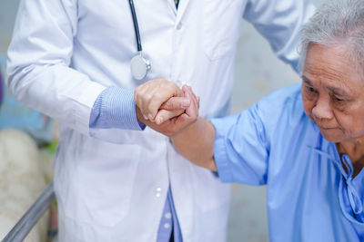 Midsection of a man with hands