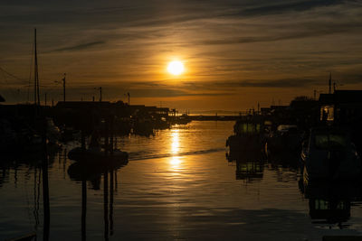 Silhouette of marina at sunset