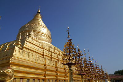 Low angle view of temple building against clear sky