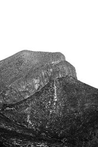 Low angle view of rock against clear sky