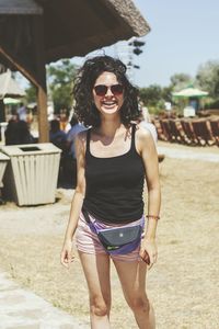 Portrait of young woman standing outdoors