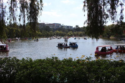 Boats in lake against sky