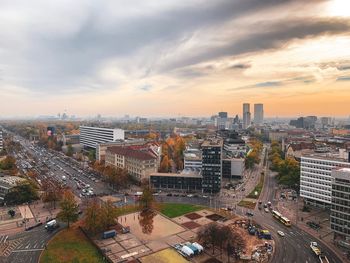 High angle view of buildings and a roundabout of berlin against sky during sunset