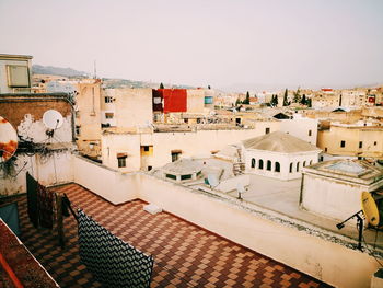 High angle view of buildings in city against clear sky