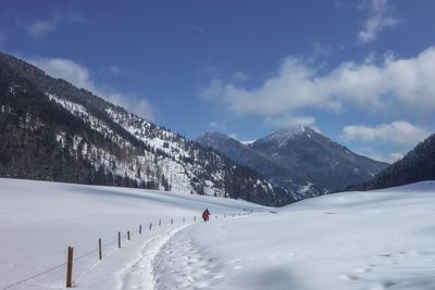 Scenic view of snowcapped mountains against sky