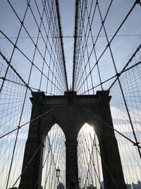 Low angle view of brooklyn bridge against sky during sunset