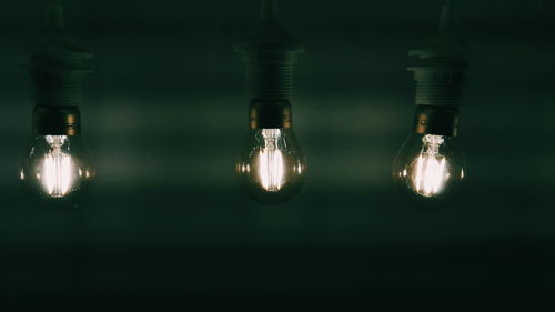 Close-up of illuminated light bulb