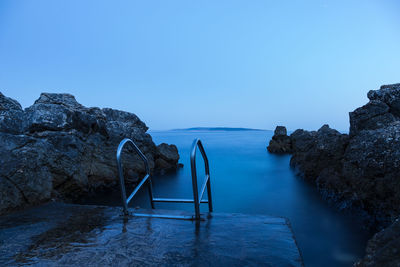 Scenic view of sea against clear blue sky