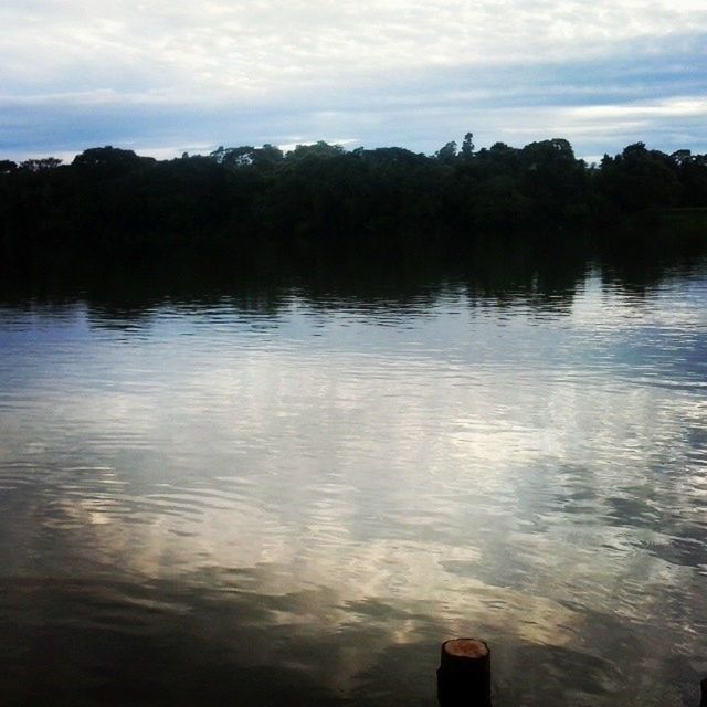 water, sky, lake, reflection, tranquility, tranquil scene, cloud - sky, scenics, tree, beauty in nature, nature, waterfront, river, cloudy, idyllic, cloud, calm, built structure, outdoors, non-urban scene