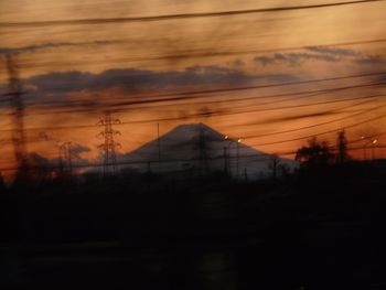 Scenic view of landscape against sky at sunset