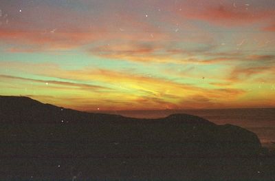 Scenic view of mountains at sunset