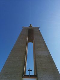 Low angle view of temple against clear blue sky