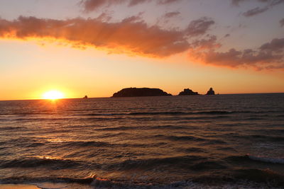 Scenic view of sea against sky during sunset