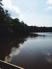 Scenic view of lake against cloudy sky