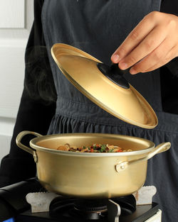 Midsection of man preparing food in kitchen