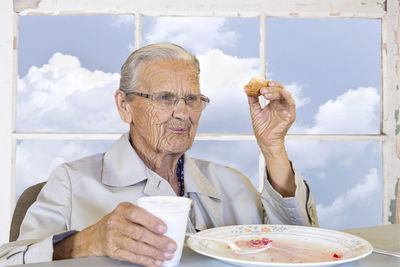 Portrait of man sitting on table