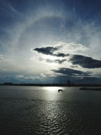View of calm sea against cloudy sky