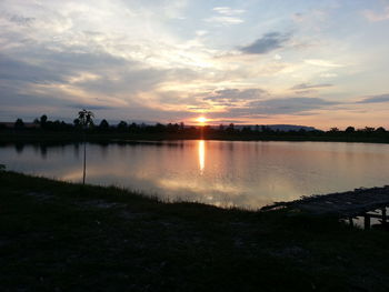 Scenic view of lake at sunset