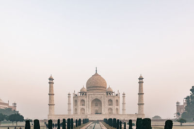 Taj mahal at foggy sunrise in winter