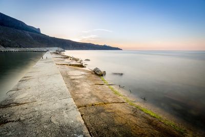 Scenic view of sea against sky at sunset