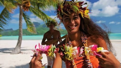 lifestyles, leisure activity, holding, flower, focus on foreground, person, sea, freshness, tree, water, young women, waist up, sky, nature, incidental people, beauty in nature, headshot