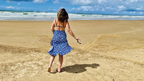 Rear view of woman on beach