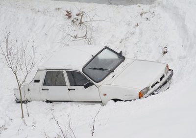 Car on snow covered field