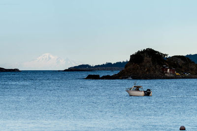 Boat in sea against sky