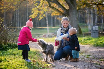 Family with dog at park