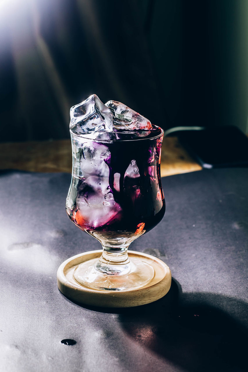 glass, food and drink, no people, drink, indoors, blue, frozen, cold temperature, table, refreshment, freshness, close-up, black, still life